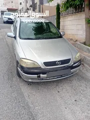  1 اوبل استرا 2004 لون سلفر