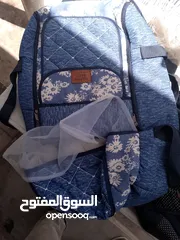  5 مستلزمات بيبي حديثي الولادة والرضع كووت وشنته وكارسيت وفرشة لعب وغيار موجودات بالبقعة