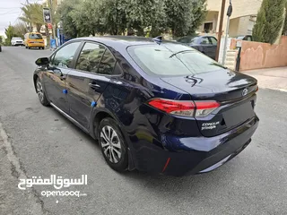  12 تويوتا كورولا 2021 ياباني بطارية ليثيوم قطعت مسافه 30 الف جمرك جديد بسعر مغري جدا