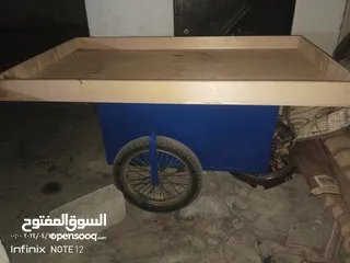  1 عرباية خضرة مع مفرش وميزان وعجل سبير شبه وكالة مع قفل عدد 2 وجنزير