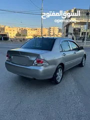  9 ميتسوبيشي لانسر فحص كامل 1600اصلي ولا ملاحظه موديل 2009 اوتوماتيك بوضع الشركه وارد الكويت مالك واحد