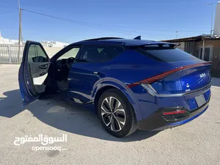  3 كيا ev6 2023 GT LINE  ممشى قليل بحالة الزيرو  6700 ميل  فل كامل اعلى صنف  لون كحلي مميز  داخلية اسود