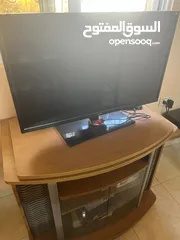  1 طاوله شاشه شبه جديده قاعده متحركه