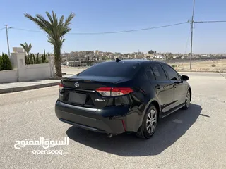  6 تويوتا كورولا 2020 هايبرد لون اسود حره باسم المستورد