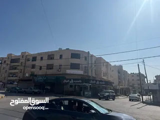  14 مجمع تجاري في وسط إربد عبارة عن محلات وشقق مع تسوية