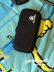  7 نينتيندو سويتش + 2 joy con إضافيتان مع شمعة مع مسكتين مع اغراضه ( بدون ألعاب )و شنتة
