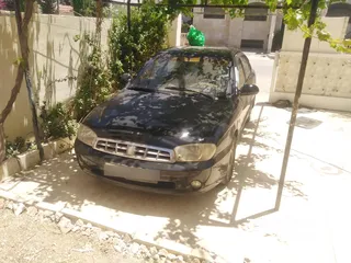  1 كيا سبكترا 2001 Mr لون اسود ملوكي بسعر مغري