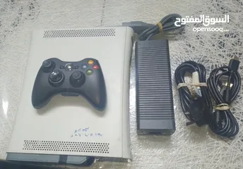  1 xbox 360 fat مع كامل ملحقات + فلاش حجم 8 جيجا +العاب   قرص واحد اصلي واثنين كوبي + شاحن يدة اكس بوكس