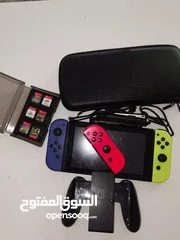  1 NINTENDO SWITCH مع 7 اشرطة  وحدة تحكم اضافي  وجميع مستلزماتها مثل في الصور  اقرأ الوصف