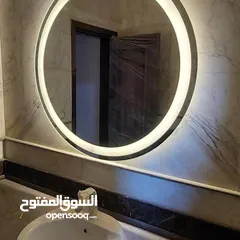  1 مرآة LED الذكية – إضاءة مميزه جدا ،  تشغيل كهرباء، كبسة لمس، قطر 70 سم.  متوفرة بإطار ذهبي أو بدون