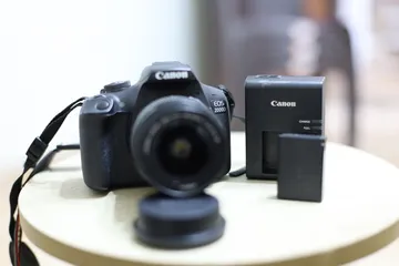  1 كاميرا كانون 2000D + عدسة 18-55mm  بحالة ممتازة وبسعر مغري جدا