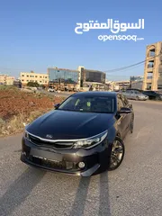  1 كيا K5 هايبرد موديل ال 2018 لون فيراني ميتالك  فحص اربعة جيد ولا ملاحظة فل كامل عدا الفتحة - كاش