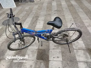  1 بسكليت مع غيارات و منصب خلفي