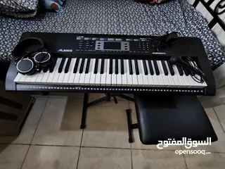  2 Piano/Keyboard(With piano stand,seat,Headphones and mic for practic )