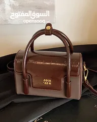  3 حقيبه لون بني غامق ، جلد من الأعلى ، مع حزام .