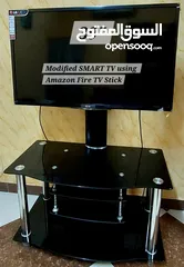  2 LG 39" SMART TV & Stand using Amazon Fire TV Stick. Original packaging and owners manual available.
