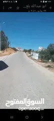  1 بيت مستقل مع محلين على الشارع اريسي. للبيع في بلعين