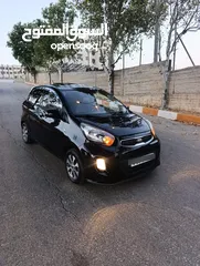  1 كيا مورننغ مع فتحة سقف وبصمة
