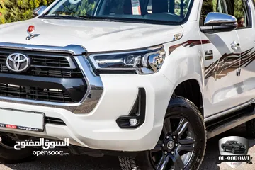  4 Toyota Hilux 2023   البكب وارد و كفالة الشركة و قطع مسافة 14,000 كم فقط