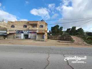  2 عمارة تجارية و سكنية  في جرش للبيع العمارة على شارعين    شارع رئيسي و شارع فرعي في منطقة حيوية