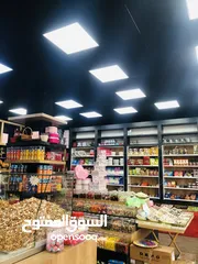  11 محل تجاري ع الشارع الرئيسي منطقه حيويه