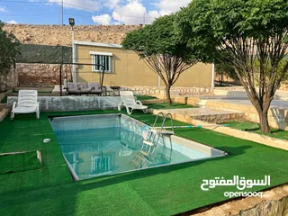  1 ارض للبيع مع مسبح وبناء كرفان تفصيل مسنسله مشجره