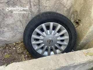  2 جنط نيسان مع كوشوك نص عمر وطاسه اصليه