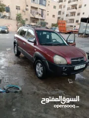 2 جيب هونداي توسان موديل 2007 ماطور 2000 لون خمري كام لا ينقصه شيئ