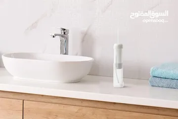  1 جهاز فلوسر لتنظيف الاسنان بالماء من شركه كوجان الاستراليه