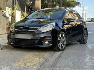  6 كيا ريو 2016 فل مع فتحه مميزه لون اسود نادر ومميز بالنضافه