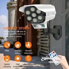  1 ضوء على شكل كاميرا وهميه يعمل على الطاقه الشمسيه مع حساس حركه