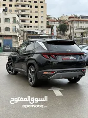  15 هونداي توسان ترخيص 2022 محرك 1600 هايبرد plug in/يقطع على الشحنه 65 كيلو متر  جير أوتوماتيك