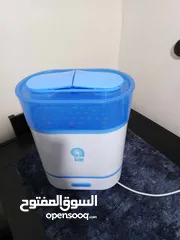  4 مرجيحة بيبي جونيورز  وجهاز تعقيم و تسخين الرضاعات