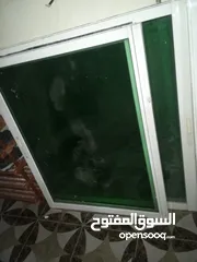  2 شباك المنيوم عدد 2 الأول طول 2×122 الثاني 2.5 × 125 سم بحال الوكاله مع الحلق