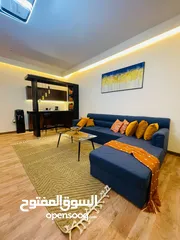  10 Two rooms and a hall for monthly rent in Ajman, overlooking the creek, new furnishings, Al Rashidiya