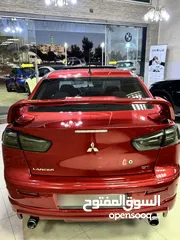  4 ميتسوبيشي لانسر موديل 2015 GT اصلي فحص كامل بحالة الوكاله فل كامل اعلى صنف من فئتها
