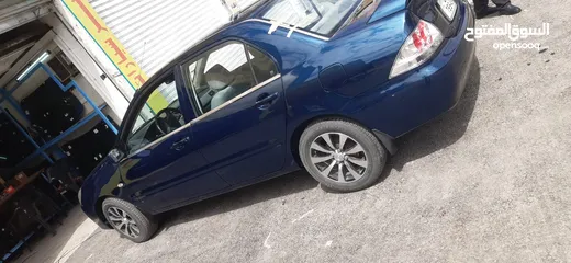  3 ميتسوبيشي لانسر 2004 1300 سي سي  بحالة جيدة
