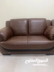  3 7 seater leather sofas with 2 wooden tables and 3 seater recliner