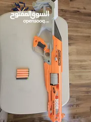  1 accustrike toy blaster with 5 bullets, 4 similar and 1 diffent