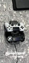  7 Ps4 with two controllers and 4 games including overwatxh ultimate edition