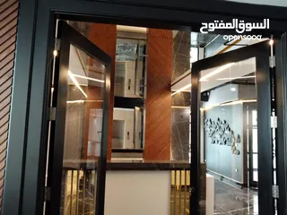  15 تفصيل تنفيذ وصيانة ابواب واجهات السيكوريت بافضل جوده ووقت وسعر
