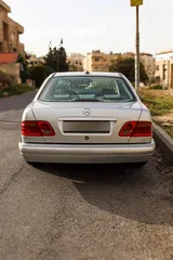  19 مرسيدس E200  موديل 1999 فل مع فتحة