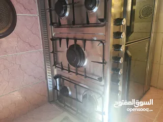  1 Cooking range and kitchen shelves