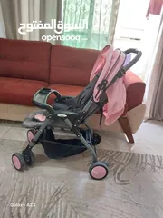  1 عرباية اطفال a-baby لون زهري للبيع