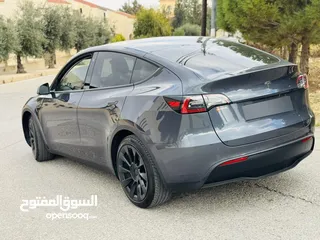  9 تيسلا سبع مقاعد داخله بشركة تيسلا الأردن  موديل Y LONG RANGE DUAL MOTOR 2022