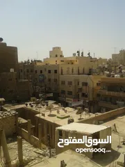  1 عماره - وسط السوق  شارع بغداد مقابل عامر الخياط- 5 طوابق - مصعد