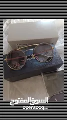 1 نظارة شمسية ماركة برادا prada اصلي  مع كافة اغراضها