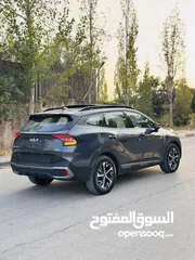  5 كيا سبورتاج هايبرد 2023 فل كامل مع بانوراما - باللون المميز والداخلية المميزة - والسعر المميز