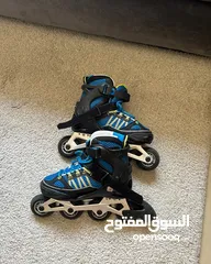  7 DECATHLON TWO ROLLER SKATES BLADES WITH 2 BAGS AND ONE SET OF PROTECTION MESSAGE ONLY