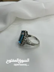  15 *خاتم فضة بحجر أكوامارين – عيار 925، وزن 5.4 جرام